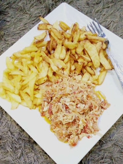 A picture of Fried potato with egg sauce.