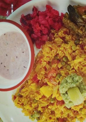 A picture of Vegtable Pulao,bundi raita,amla chutney aur beetrot radish salad.