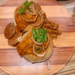 Butter Chicken Bunny Chow A picture of Butter Chicken Bunny Chow.