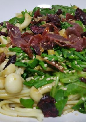 A picture of Pasta with rocket, mushrooms and crunchy ham.