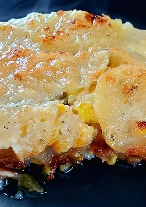 A picture of Jalapeno Corn Scalloped Potatoes with garlic and lime bechamel.