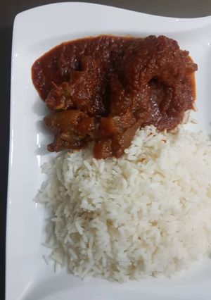 A picture of Stew and rice.