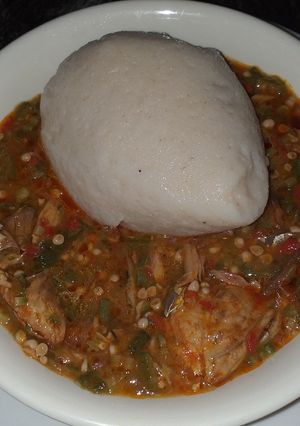 A picture of Maize and cassava swallow with okro soup.