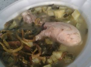 Una foto de Pollito en salsa verde con calabazas y verdolagas