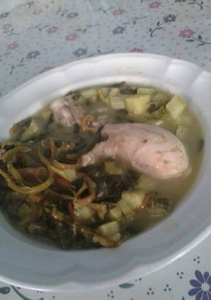 Una foto de Pollito en salsa verde con calabazas y verdolagas