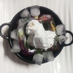 Peanut Ice cream with a hint of chilli(served in ice bowl) A picture of Peanut Ice cream with a hint of chilli(served in ice bowl).