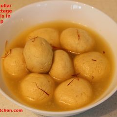A picture of Kesar Rasgulla / Saffron Cottage Cheese Balls In Sugar Syrup.