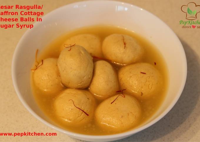 Kesar Rasgulla / Saffron Cottage Cheese Balls In Sugar Syrup