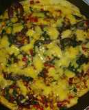 Torta de huevo con flor de calabaza, hierba mora y queso