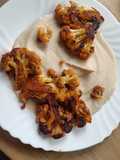 Steak de Coliflor sobre crema de judías blancas con ajo asado