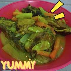 A picture of Ikan bandeng bumbu kuning/ Acar.