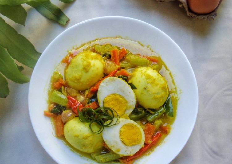 Bagaimana Menyiapkan Telur Masak Kuning, Lezat