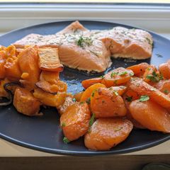 A picture of Buttery Salmon with Sweet Potatoes and Carrots.