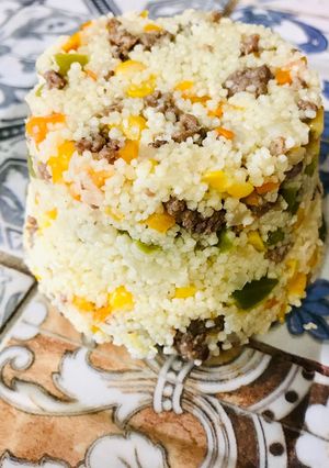 Una foto de Cous Cous con choclo y pino