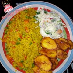 A picture of Fried rice with coleslaw and plantain.