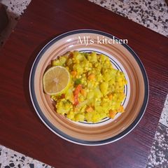 A picture of Orange flavoured avocado corn sauce with potatoes.
