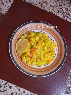 A picture of Orange flavoured avocado corn sauce with potatoes.