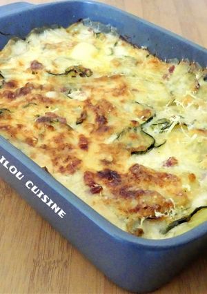 Une photo de Gratin de pommes de terre / courgettes / allumettes de bacon