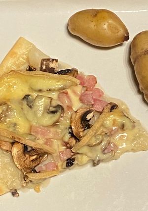 Une photo de Flammekhueche à la raclette
