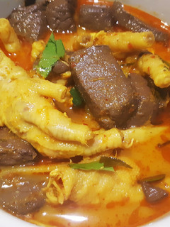 A picture of Chicken Feet and Fermented Bamboo Shoot Red Curry.