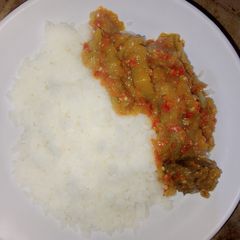 White rice and garden egg stew A picture of White rice and garden egg stew.
