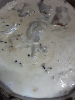 Una foto de Ravioles de ricota c/crema al verdeo y queso rallado