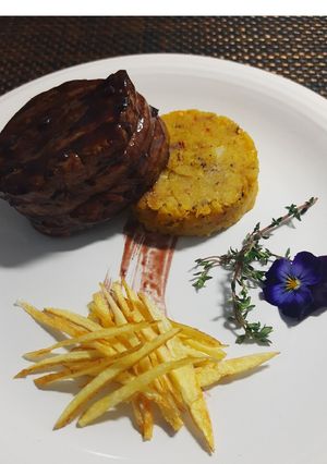 A picture of Fufú de Plátano with Beef Tenderloin Steak.