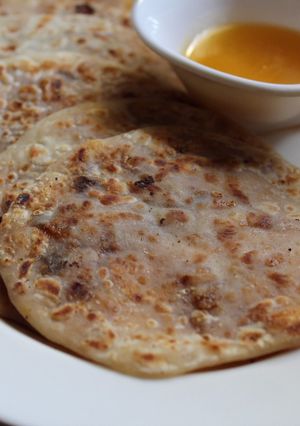 A picture of Khoya and Dates Sweet Poli/Khoya Stuffed Sweet Paratha.