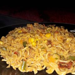 A picture of Indomine with corn and carrots.