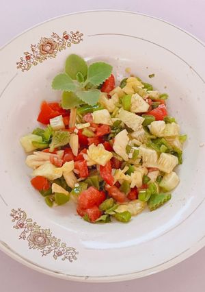 A picture of Ajwain leaf salad with veggies and pineapple.