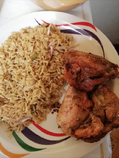 A picture of Fried rice with grilled chicken.