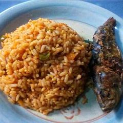 A picture of Carrot and Green Pepper Jollof Rice with Fried Fish.