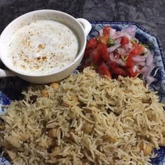 A picture of Chana rice with dry methi.