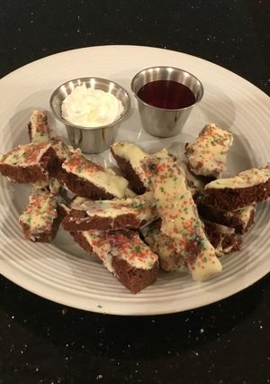 A picture of Brownie Fries with Fresh Strawberry Sauce and Whipped Creamy.