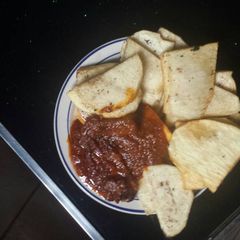 A picture of Fried yam and tomatoes stew.
