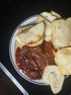 A picture of Fried yam and tomatoes stew.