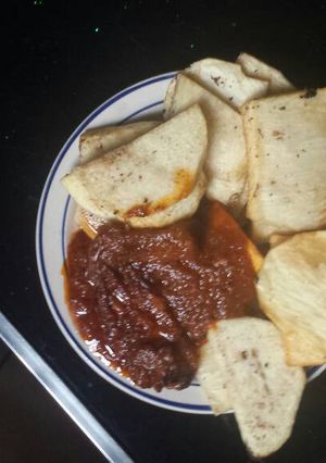 A picture of Fried yam and tomatoes stew.