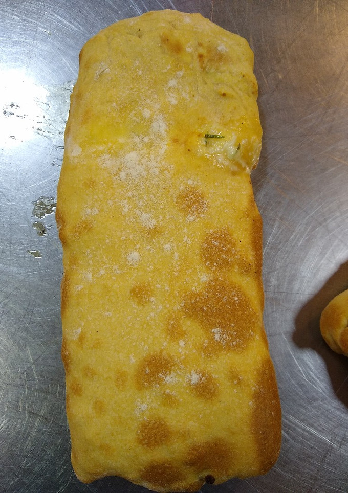 Una foto de Strudel relleno de cebolla y queso