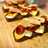 Tostas templadas con brie, tomates confitados y melva