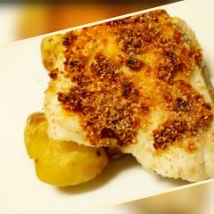 A picture of Sea bass with a sun-dried tomato crust and sautéed potatoes.