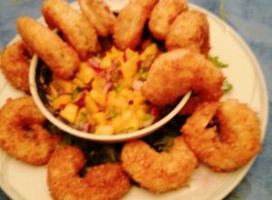 Una foto de Camarones con coco y salsa de mango