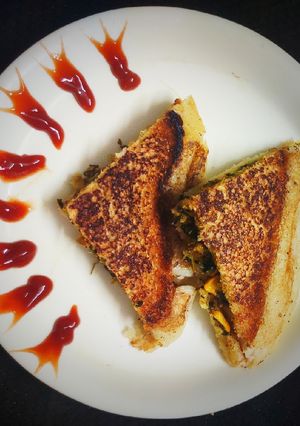 A picture of Leftover Methi Corn stuffed Rava Sandwich.