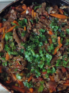 A picture of Chilli sliced Beef Mushroom In Red Pepper sauce.