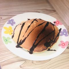 A picture of Pancake with chocolate syrup.