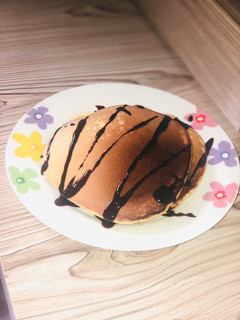 A picture of Pancake with chocolate syrup.