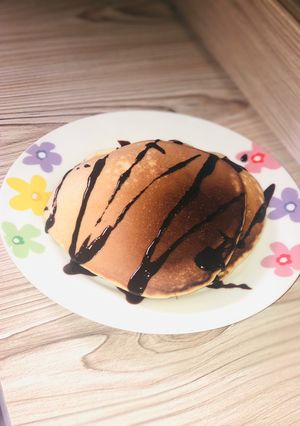 A picture of Pancake with chocolate syrup.