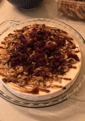 A picture of Baked Brie with Cranberries and Walnuts.