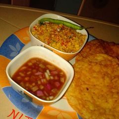 A picture of Dry Moong Dal & Pakwan with tamarind chutney.