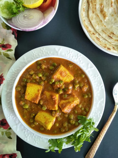 A picture of Mutter Paneer (Green Peas And Cottage Cheese Gravy Vegetable).