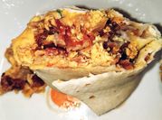 A picture of bacon breakfast burrito